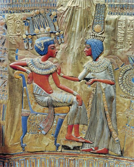 Tutankhamen on his throne, beside his royal wife Ankhesenamon. © Robert Harding