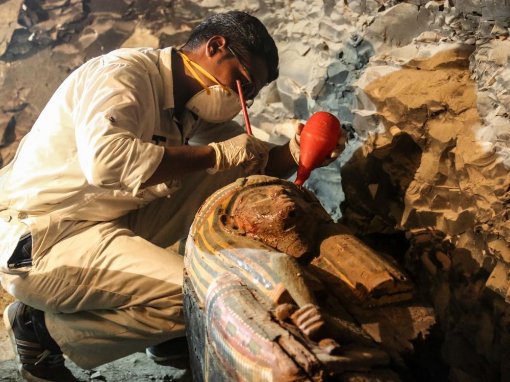 An archaeologist restores a sarcophagus in the recently discovered tomb of Amon's goldsmith Amenemhat near Luxor in southern Egypt. IBRAHIM RAMADAN / ANADOLU AGENCY